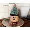 This is a handmade Christmas elf made with a real dried gourd. Including his Christmas tree hat, he is 12 inches tall and 4.5 inches wide. 